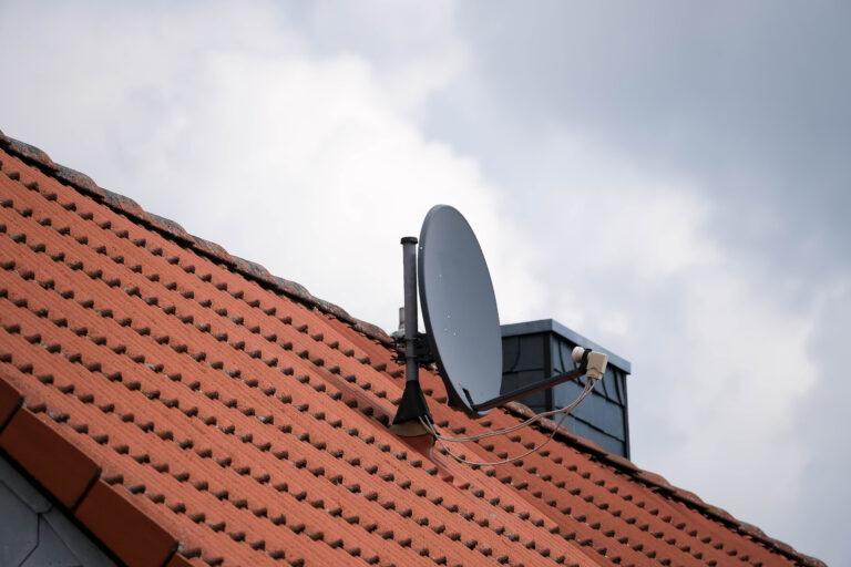 satellite dish on a red roof